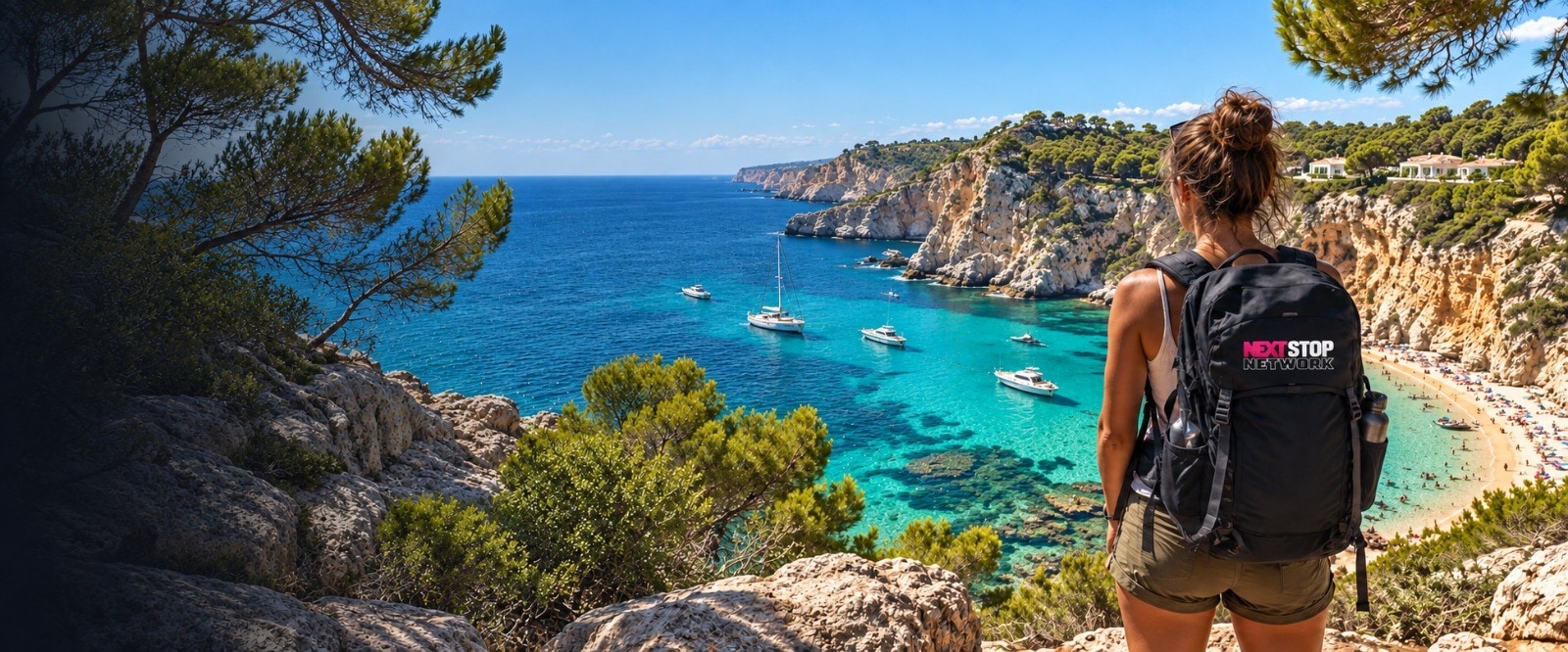 A backpacker with a NEXT STOP Network pack looking out over a turquoise Spanish cove
